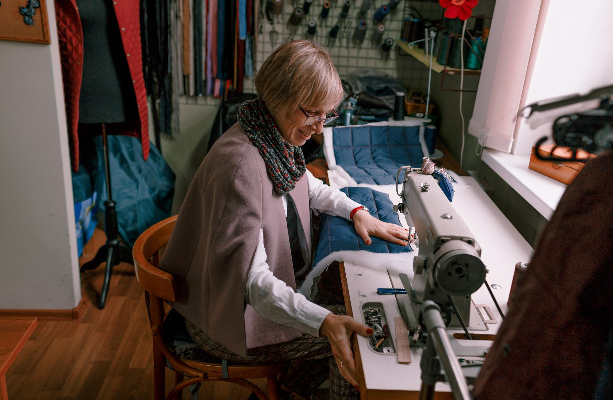 Craftsman working on embroidered detail